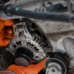 mechanic-installing-alternator-1024x683