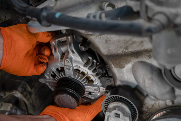 mechanic-installing-alternator-1024x683